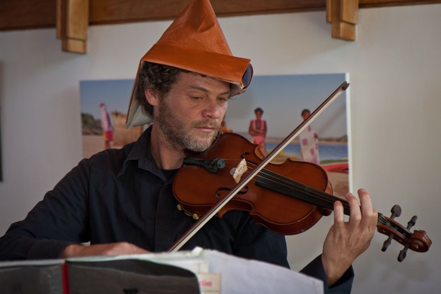 Morné plays harmonica and violin