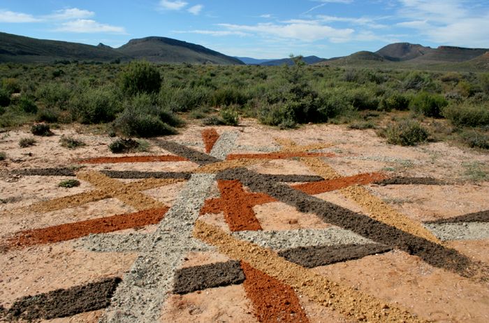 Using different color of soil found on site to draw lines